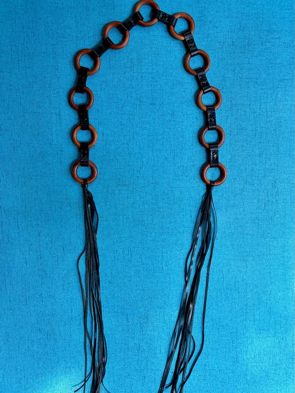 Brown leather fringe belt with wooden circular links and tassels #boho #western